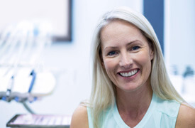 Smiling older woman in dental office