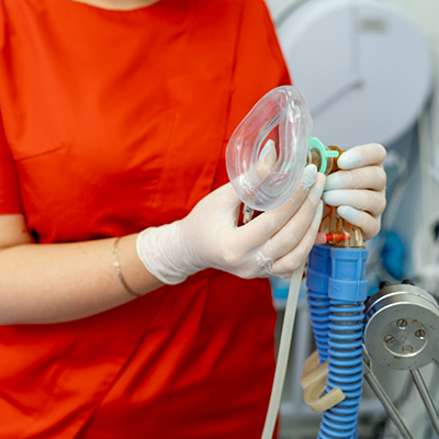 Holding a mask for nitrous oxide