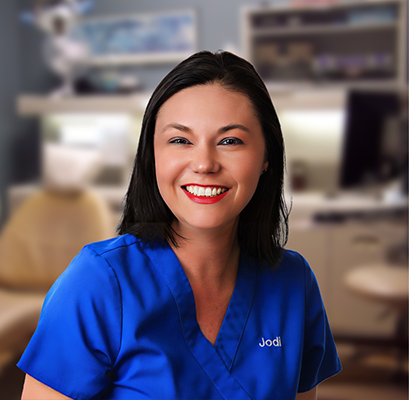Woman in blue shirt smiling