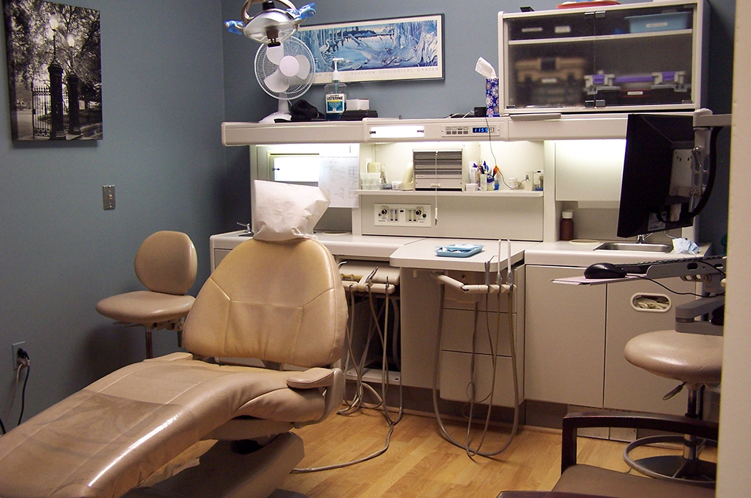 Beige treatment chair in dental office
